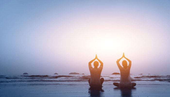 couple practicing yoga harmony of family relations
